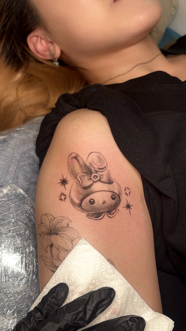 Cute Sanrio-style cow tattoo by Lydia